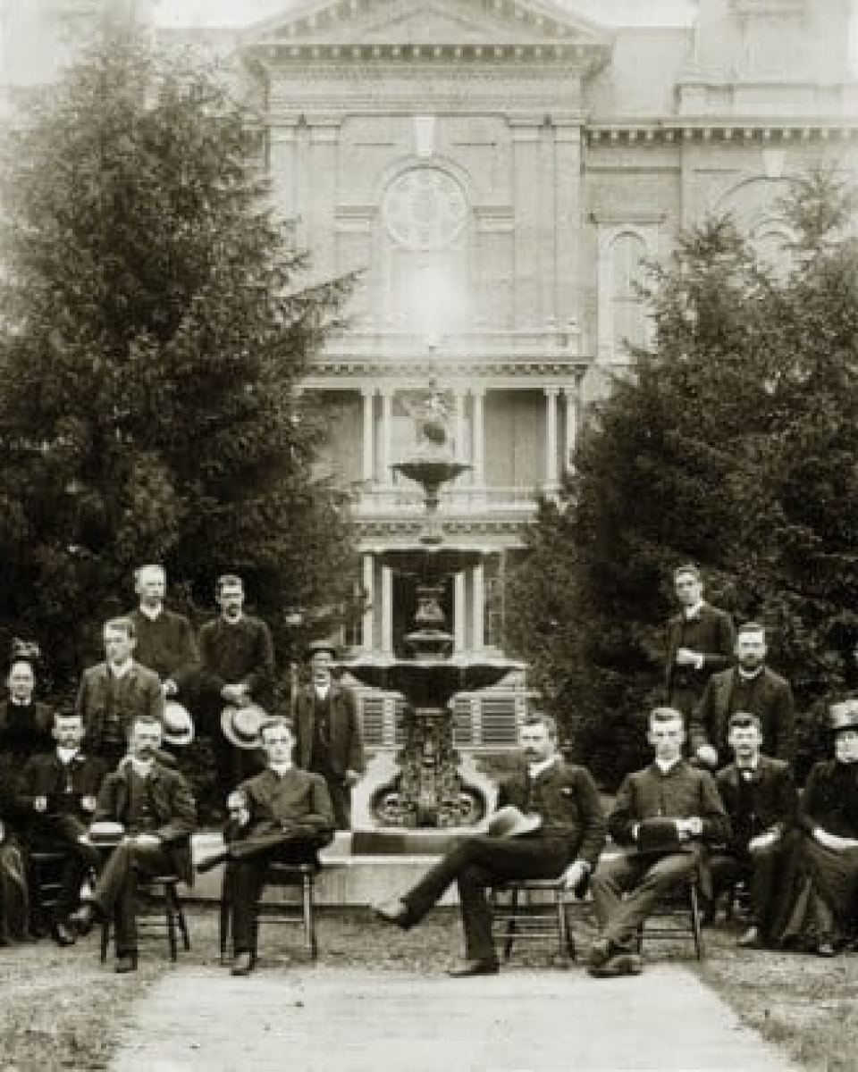 black and white old photo of people sitting